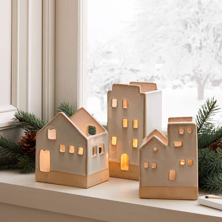 Adorable ceramic tea light houses featured in West Elm's 2020 holiday decor collection.