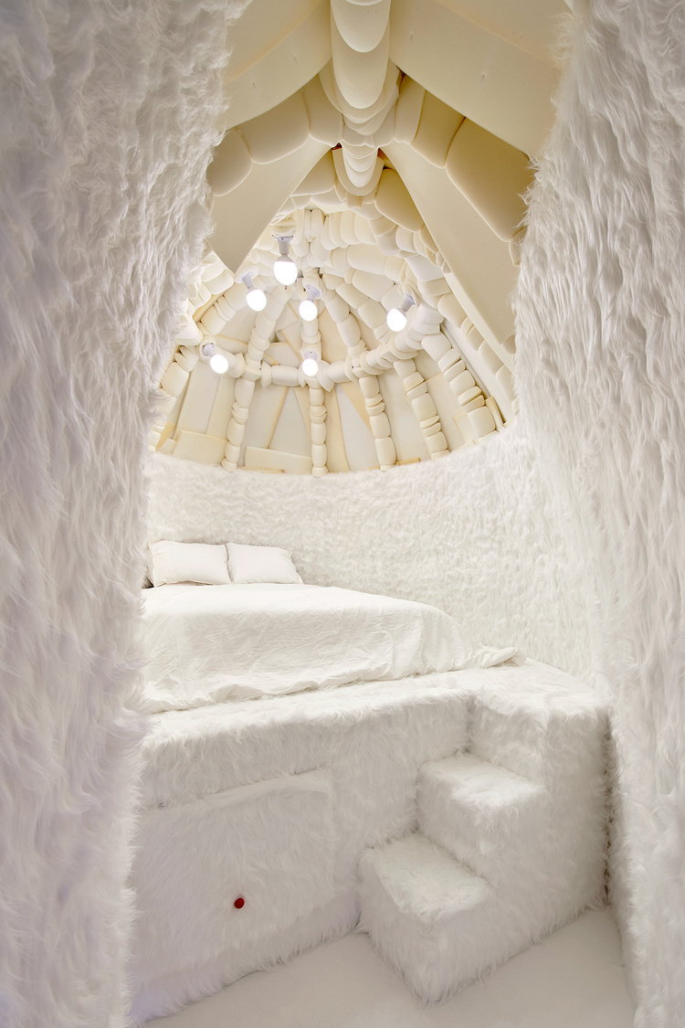 Cozy elevated sleeping area inside the Takk-designed Igloo Room.