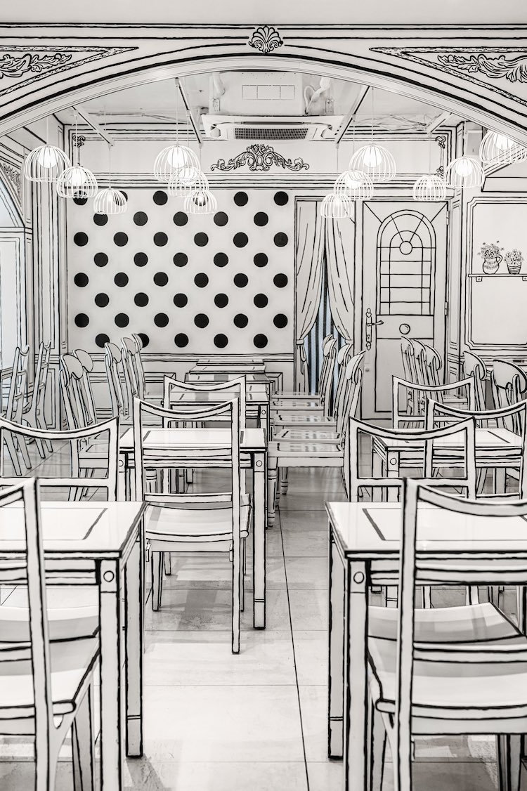 Cartoon-like black and white interiors of a 2D café in Japan.
