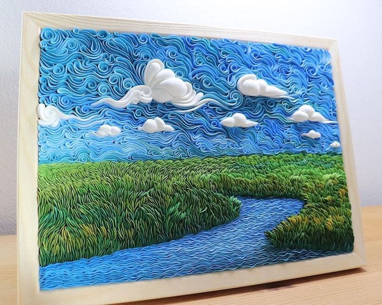 Gorgeous air-dry clay piece of a river running through green grass by artist Alisa Lariushkina. 
