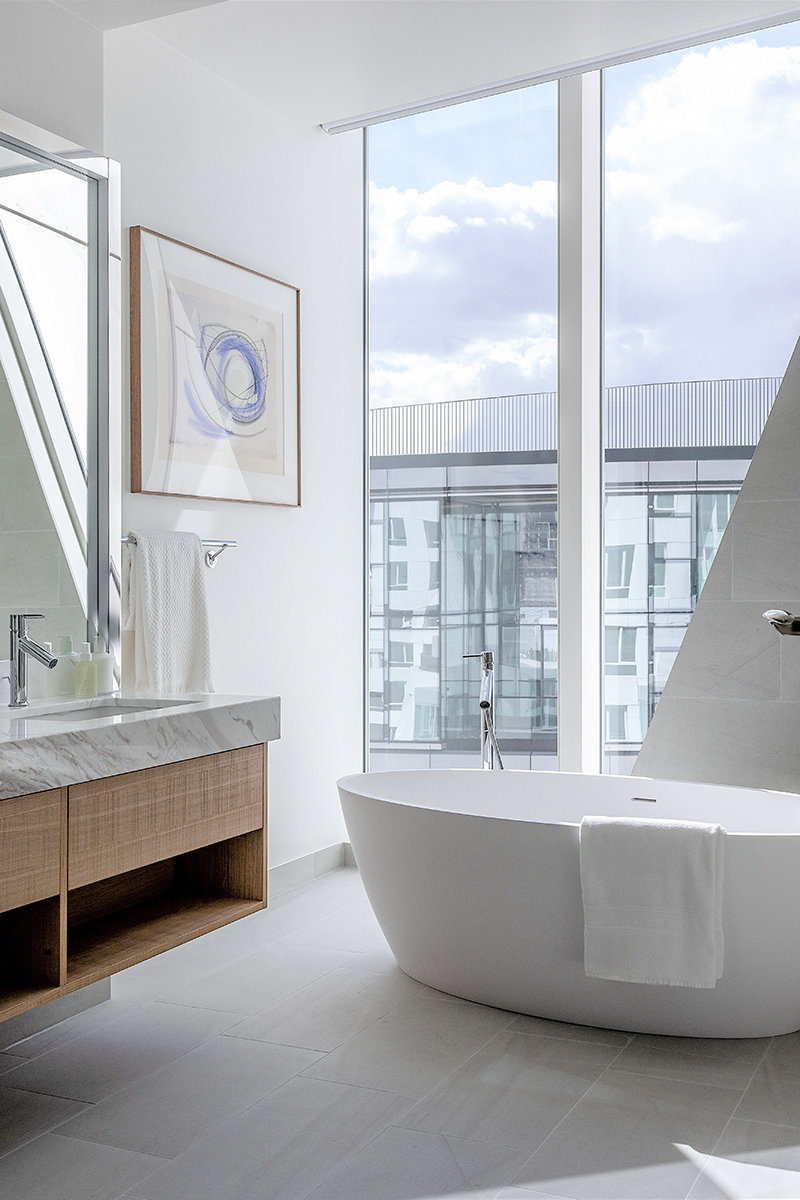 Sleek modern bathroom inside the Frank Gehry-designed Prospect Place.