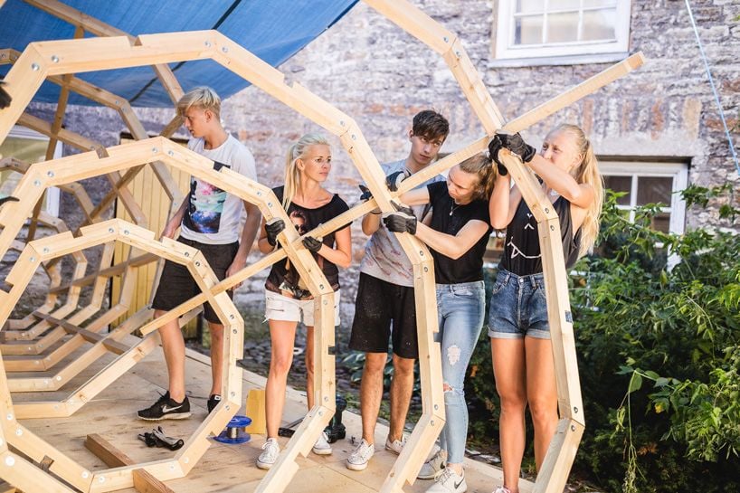 A group of architecture students from the Estonian Academy of Arts works hard to construct the giant RUUP megaphones.