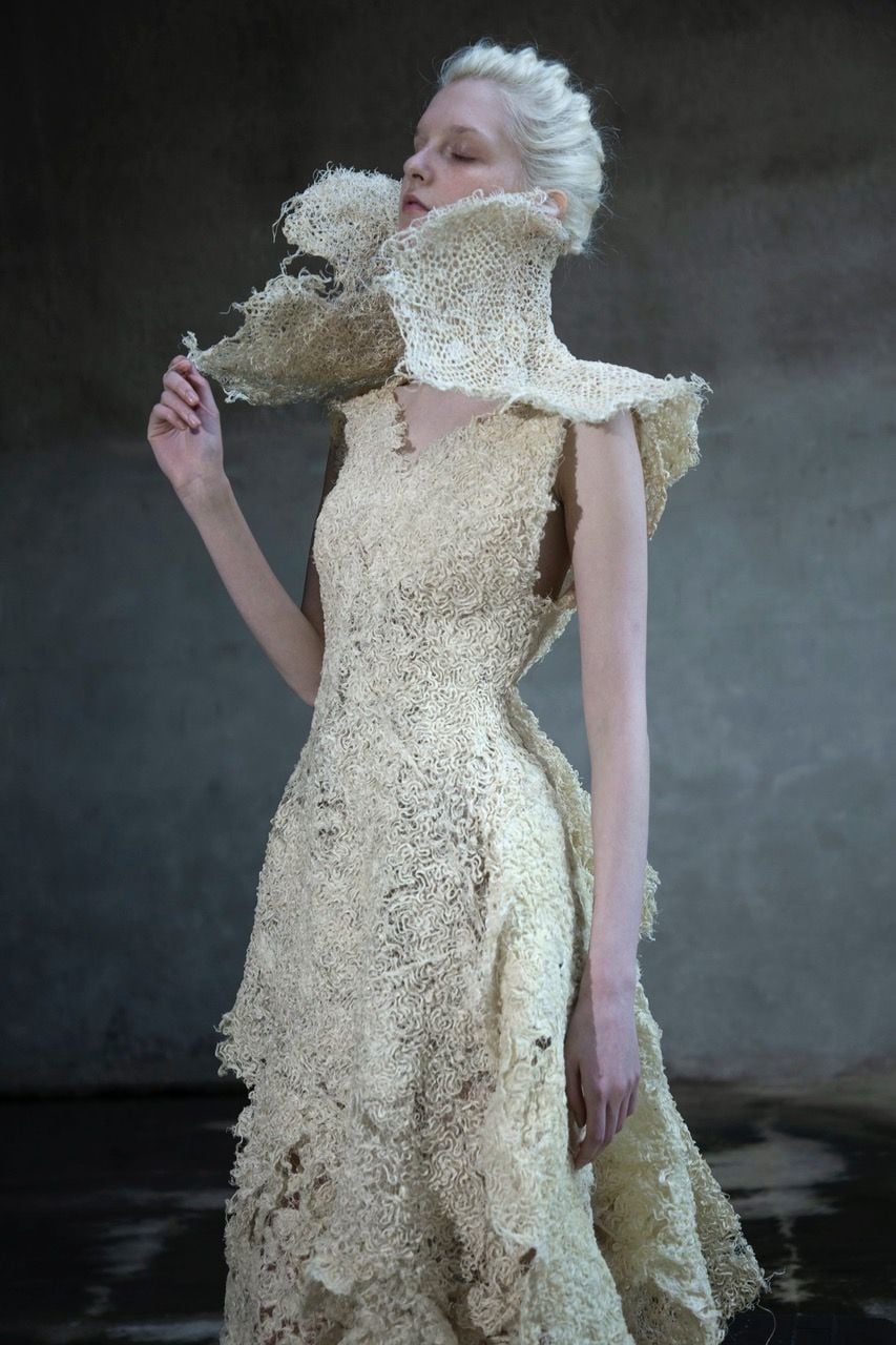 Model dons a woven root grass dress by designer Zena Holloway.