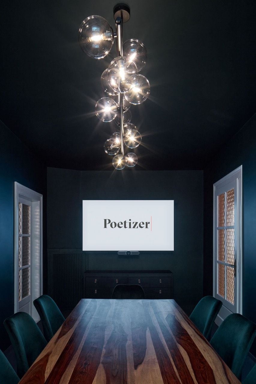 Large, dark conference room in the Tomas Cisar-designed Poetizer offices in Prague.
