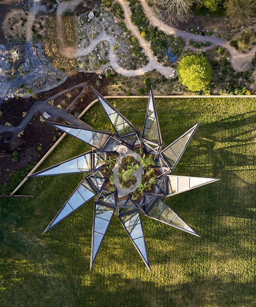 Aerial view of Thomas Heatherwick's unfurled Glasshouse on England's historic Woolbeding estate.