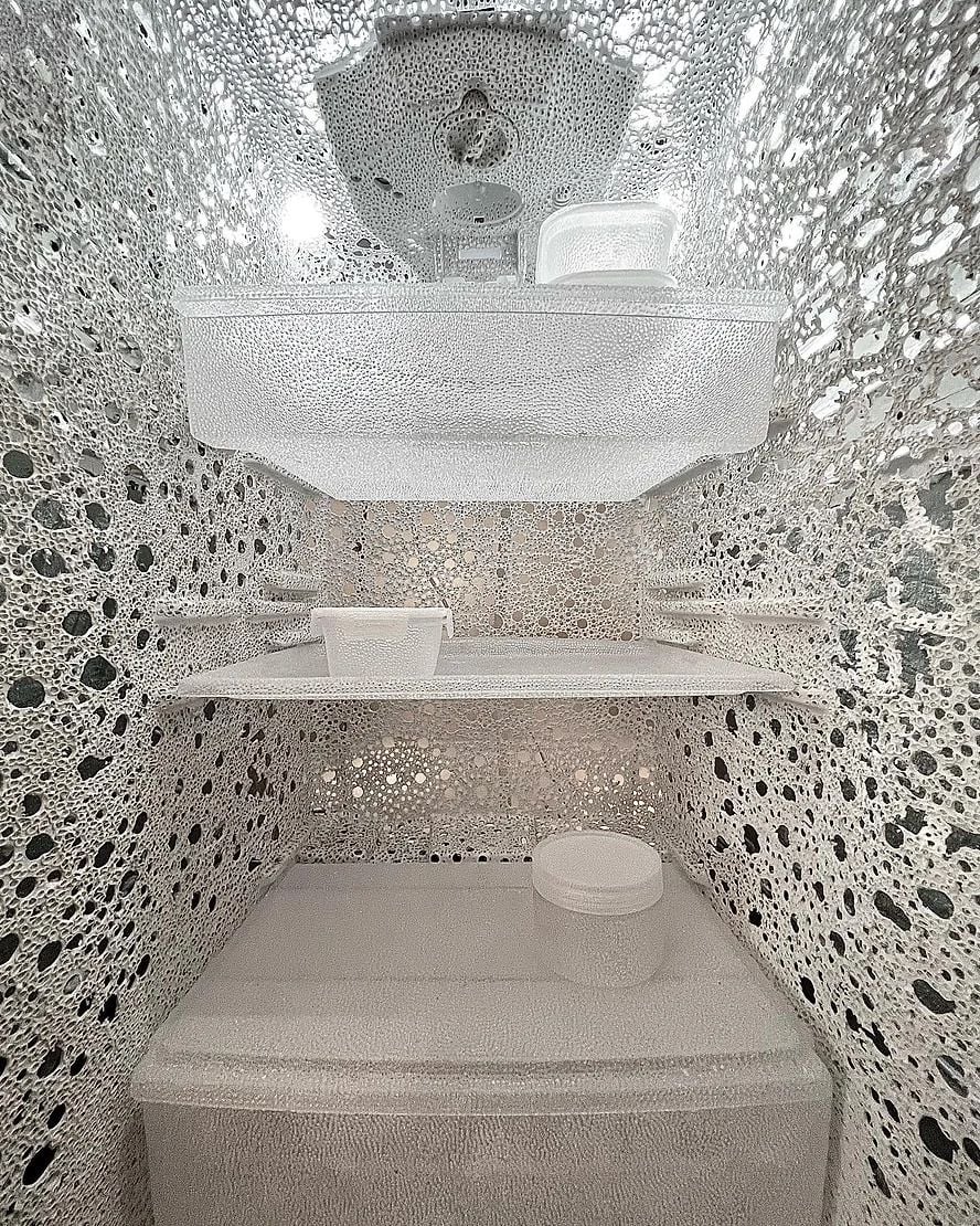 View inside the perforated plastic fridge featured in artist Nina Nomura's 