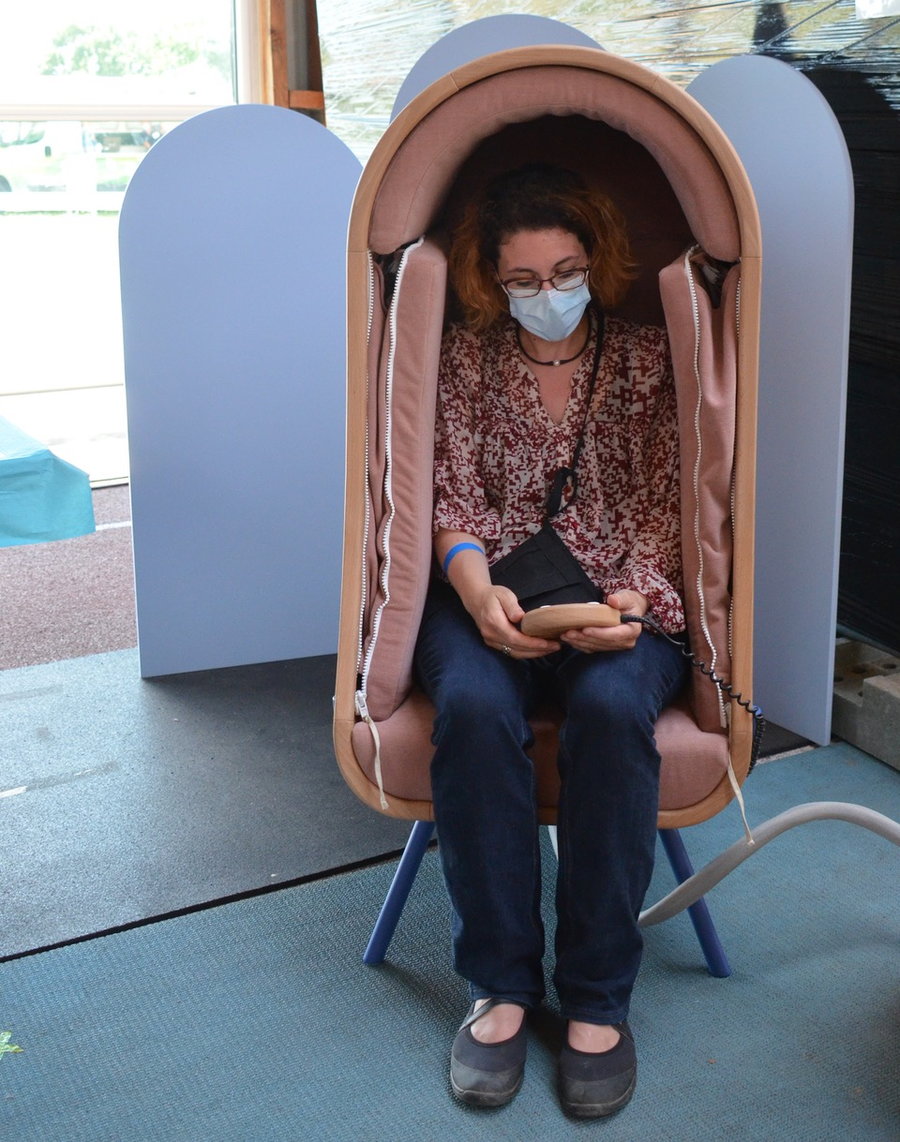 Woman sits inside Audrain Alexia's OTO Chair 