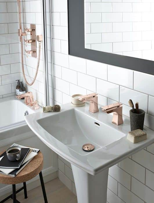 If you insist on keeping rose gold in your home through 2022, try keeping it to smaller accents like these sink handles and faucet.