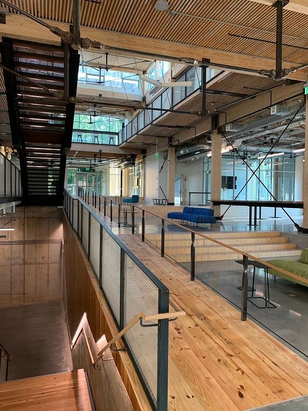 A large wooden wheelchair ramp cuts through the center of the Kendeda Building to promote accessibility.