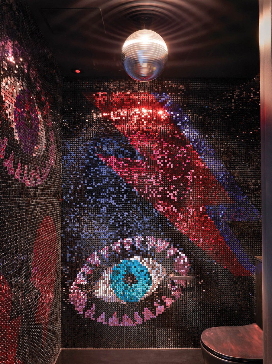 Glamorous Bowie-themed bathroom complete with a disco ball on the ceiling inside Owl Interior Design's Bowie-inspired London apartment.