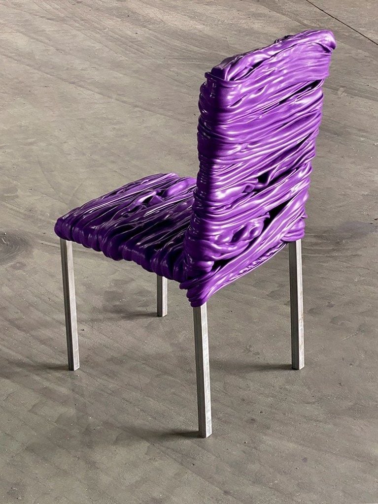 An eye-catching purple chair featured in artist Youngmin Kang's reclaimed 