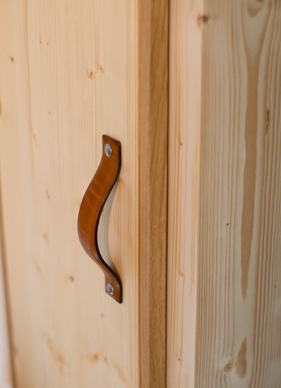Sleek leather cabinet handles help give the Nano's interiors a modern sensibility.