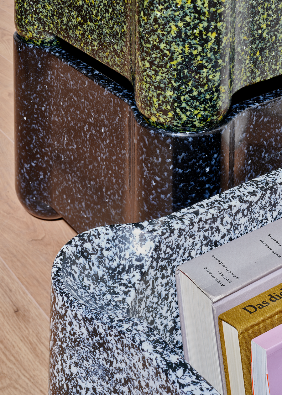 Close-up view of the recycled Afterlife furniture's terrazzo-like material pattern. 