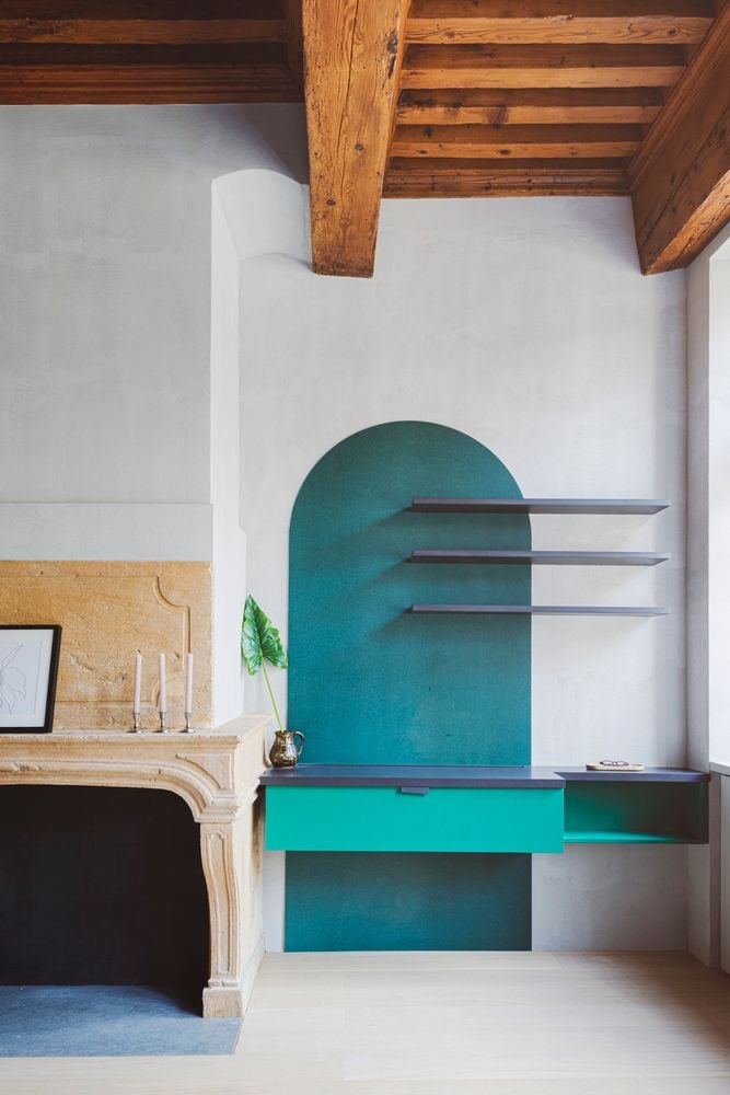 Jade green built-in desk inside the Studio Razavi-renovated Lyon apartment. 