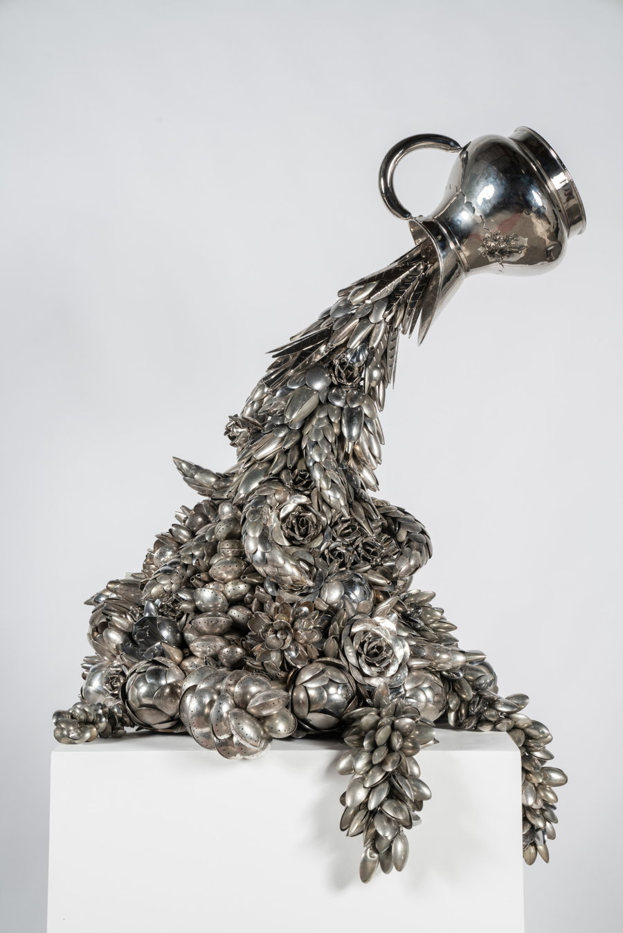 Upcycled silver pitcher by artist Ann Carrington.