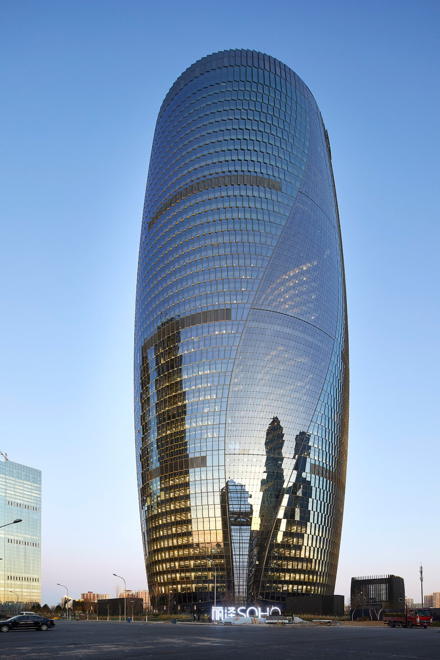 Exterior shot of the spiraling Leeza SOHO Tower, designed by Zaha Hadid Architects.