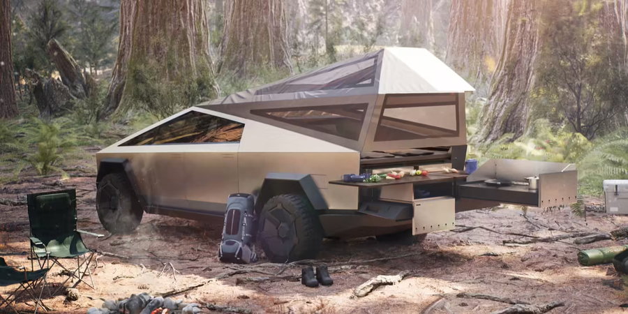 Tesla Cybertruck set up as a camping kitchen in the middle of a forest space.