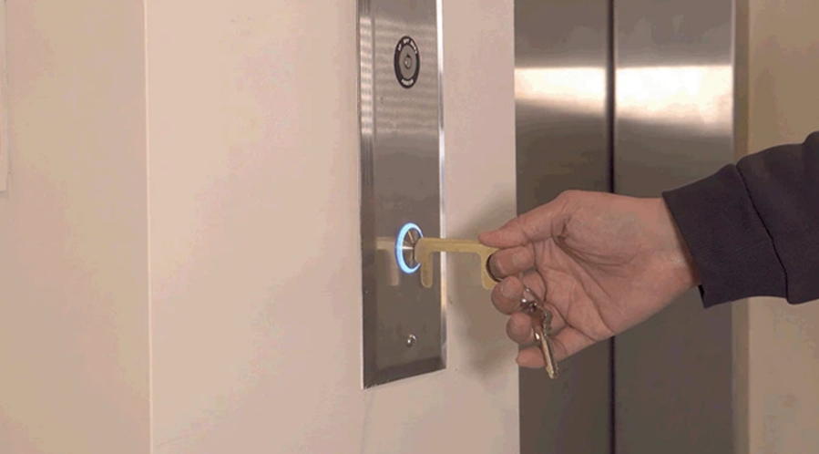 Use the antimicrobial Hygiene Hand tool to push elevator buttons and open doors. 