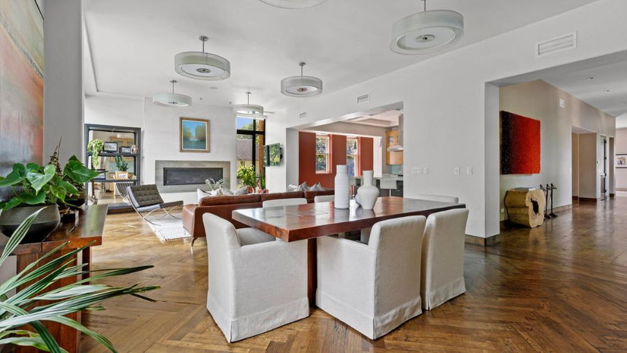 Contemporary dining area in Denver's renovated Harman Hall home.