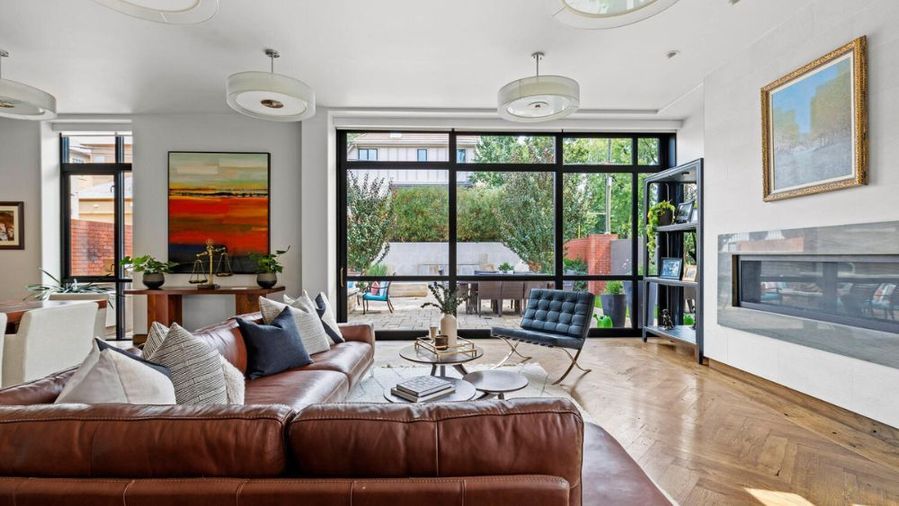 Contemporary, open plan living space in Denver's renovated Harman Hall home.