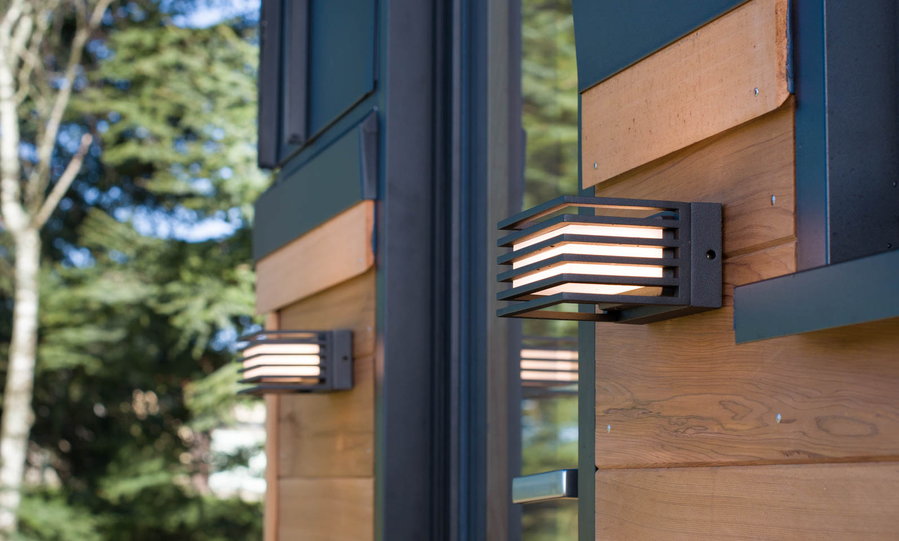 Small wall-mounted lights on the Nano's exteriors light up the entrance and add to the tiny home's modern aesthetic. 