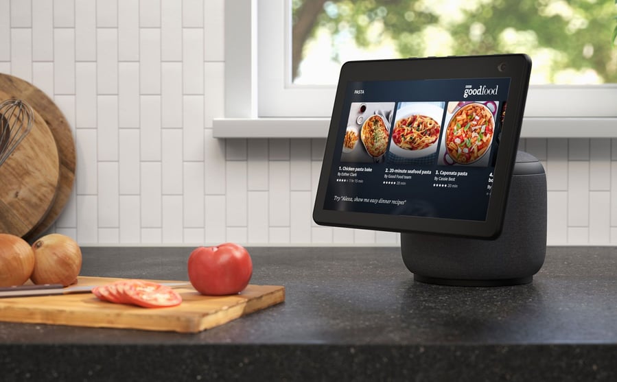 Mounted Amazon Echo Show 10 in the kitchen helps resident whip up a delicious meal.