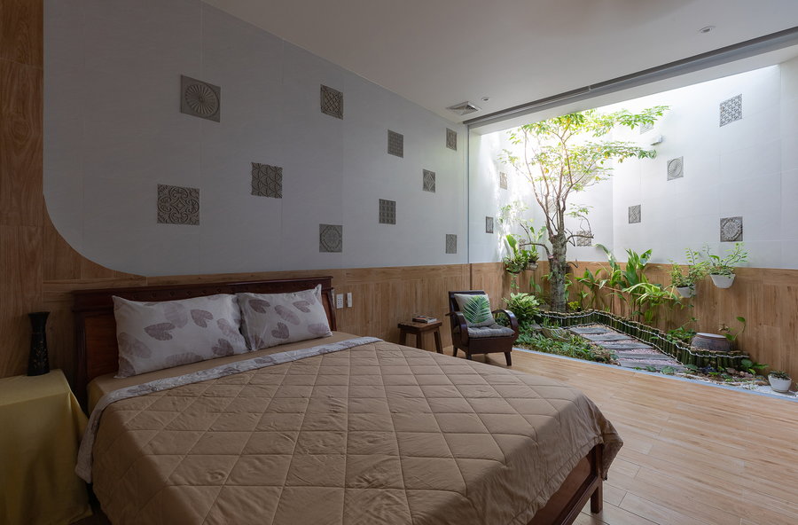 Bedroom inside the Coco House boasts its very own zen garden.