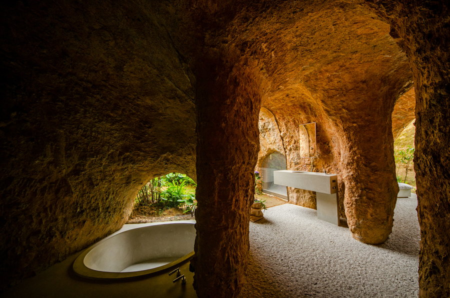 Moody cave-like bathroom area in the Junya Ishigami-designed House and Restaurant Cave in Japan.