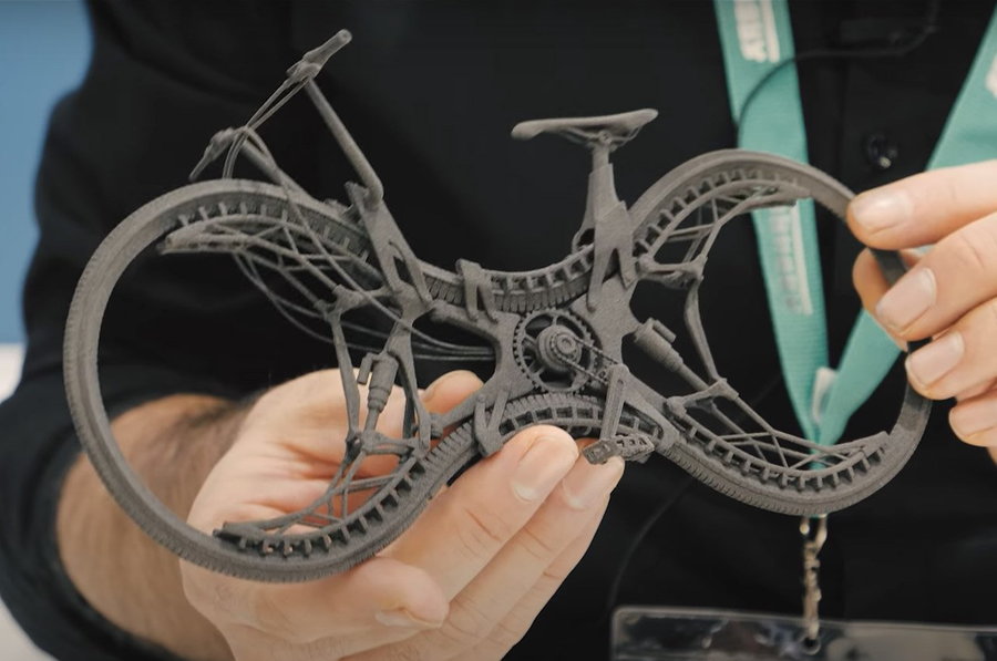 Small-scale model of designer Stephan Henrich's 3D printed Infinity Bike futuristic beach cruiser.