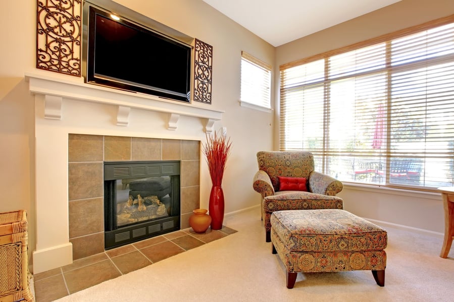 The spot above the fireplace might seem perfect for a flat-screen at first glance, but it means robbing yourself of a beautiful aesthetic focal point. 