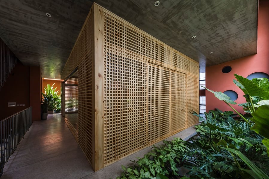 The Red Cave House's second-story yoga studio is contained inside this elegant perforated 