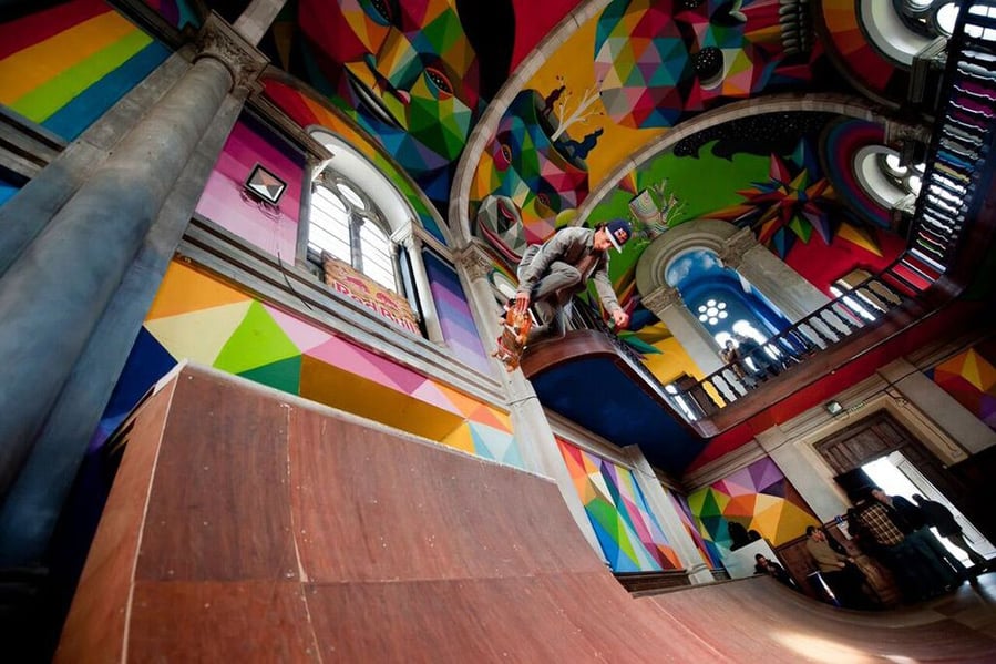 A skateboarder shreds down the Kaos Temple's main half-pipe