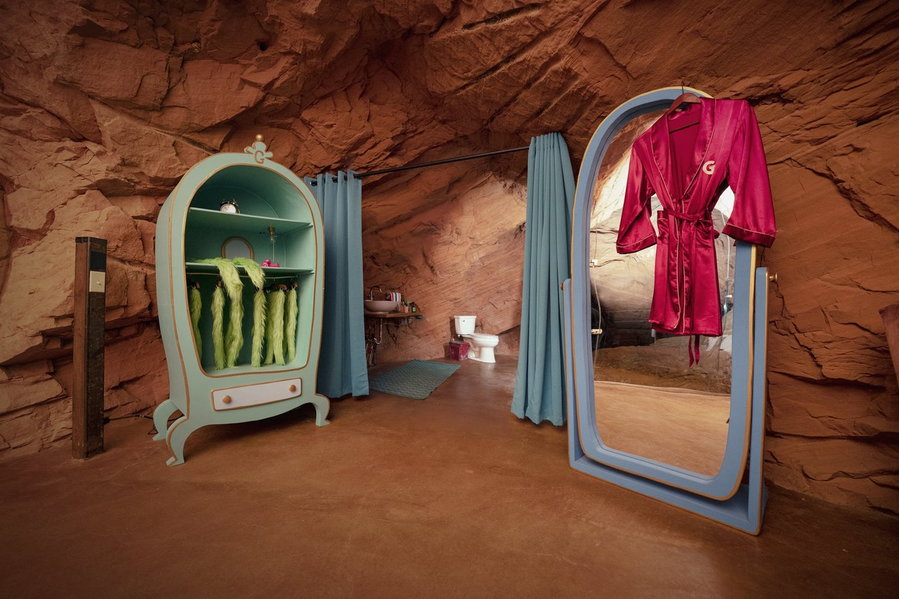 Classic Seussian decor inside Festive-feeling bedroom inside Vacasa's Grinch's Lair bathroom area.