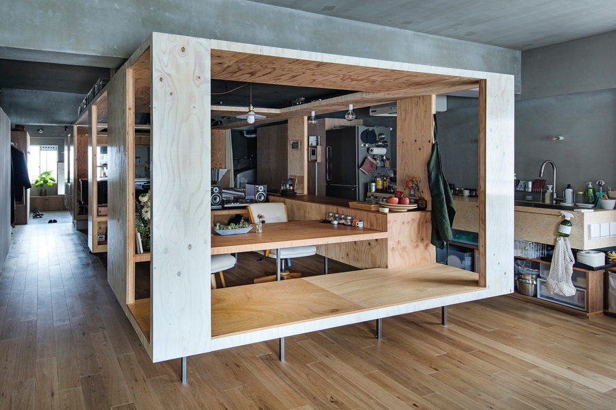 Exterior view of the plywood box that contains the dining area inside a YAP-renovated Kyoto condo.