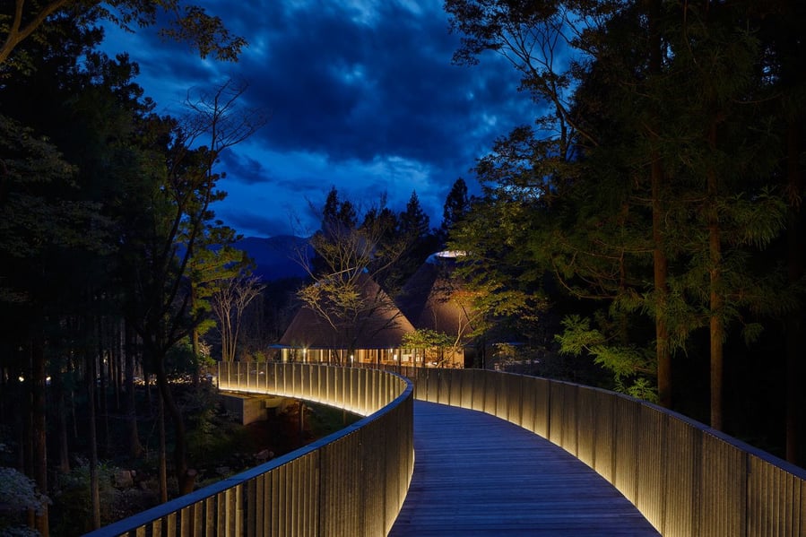 Nighttime view of the narrow bridge that leads from the main part of the Risonare Nasu resort to the new PokoPoko club house.