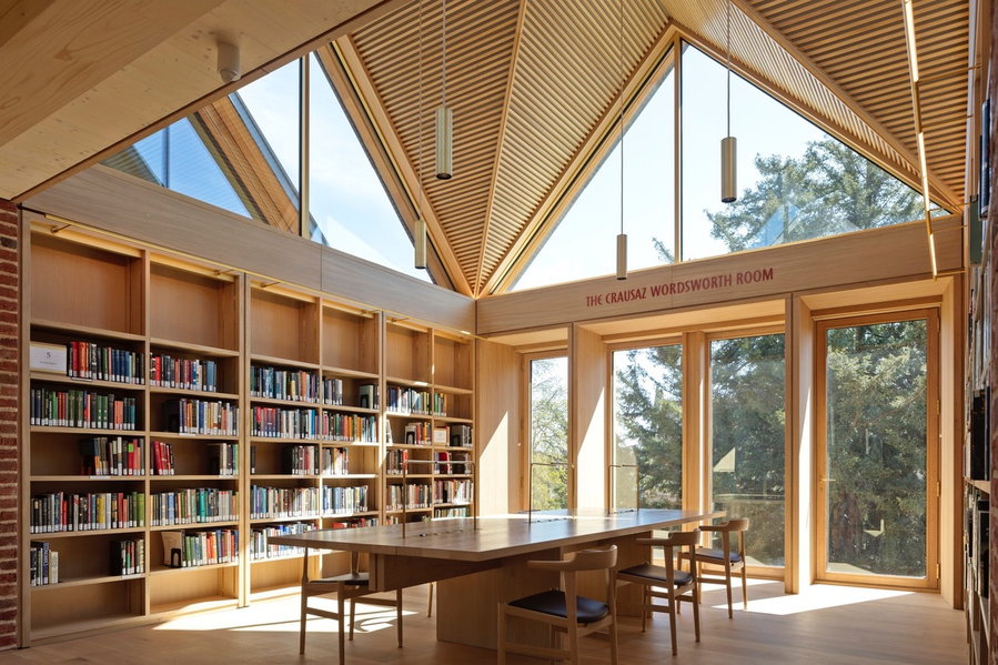 Study space inside the New Library at Magdalene College showcases a beautiful interplay of glass and wood.