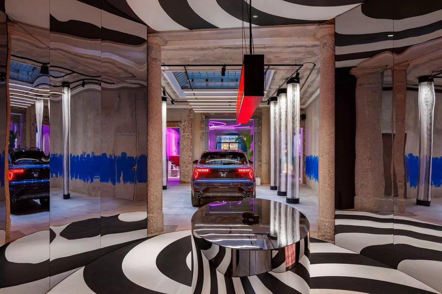 Lynk & Co's shareable 01 hybrid vehicle takes center stage in this surreal display area at their new Milan club.