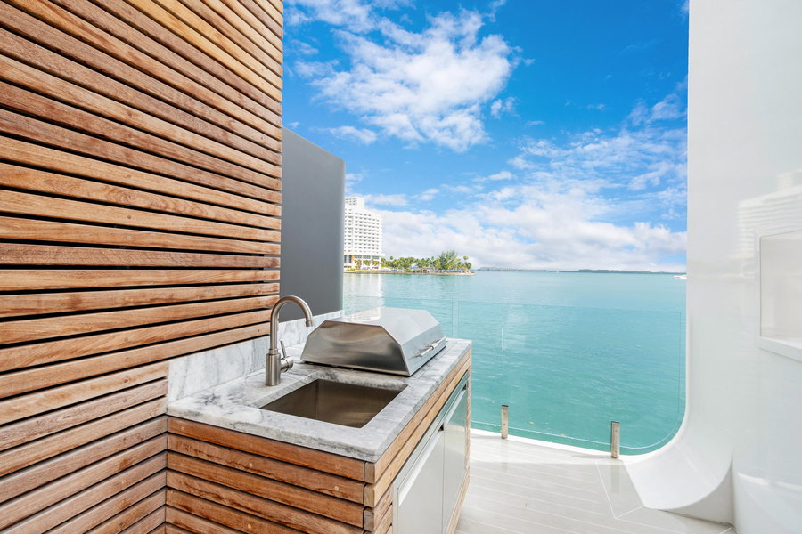 A cool coastal outdoor grill rests on the Arkup's outer edge.