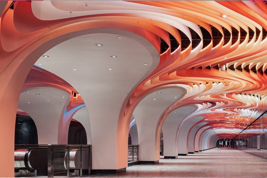 Renovated Yuyuan Station ceilings by XING Design glow a bold orange color.