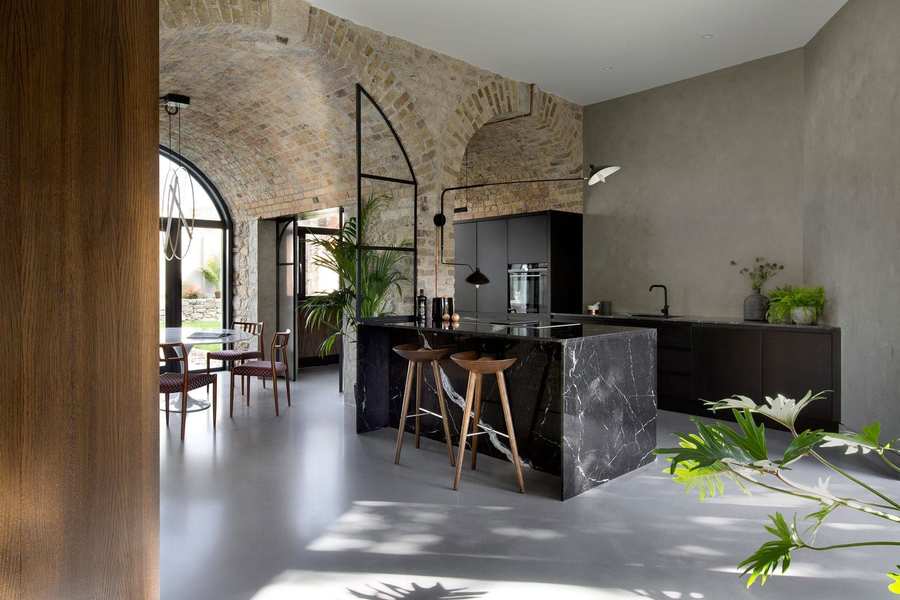 The sleek minimalist kitchen area inside the renovated Bolton Carriage House.