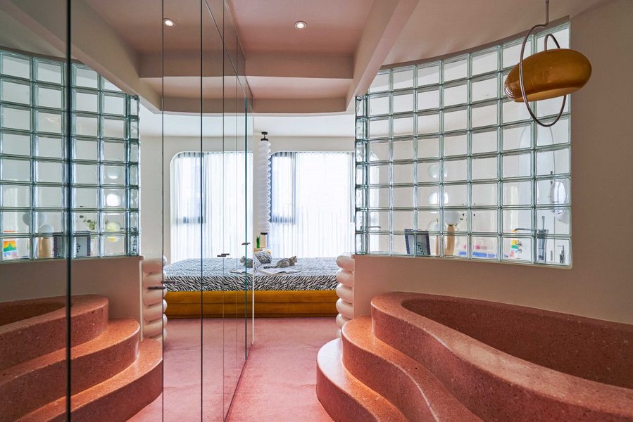 Retro mirrored hallway leads into the bedroom of the Dreamscape Apartment.