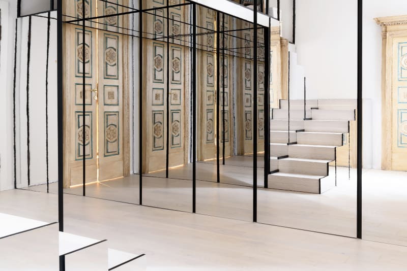 Mirrors throughout the Cavejastudio and Denara-renovated Lelefante apartment visually expand the space. 
