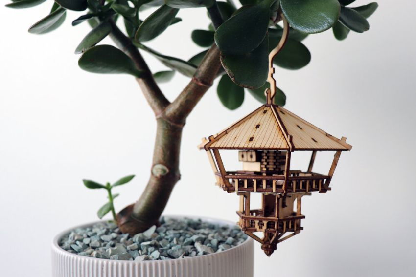 This tiny DIY treehouse hangs from an indoor houseplant like a delicate lantern.