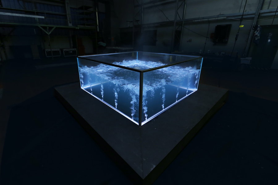 The all-glass Nautilus MK I glass hot tub emits a futuristic glow in the dark.
