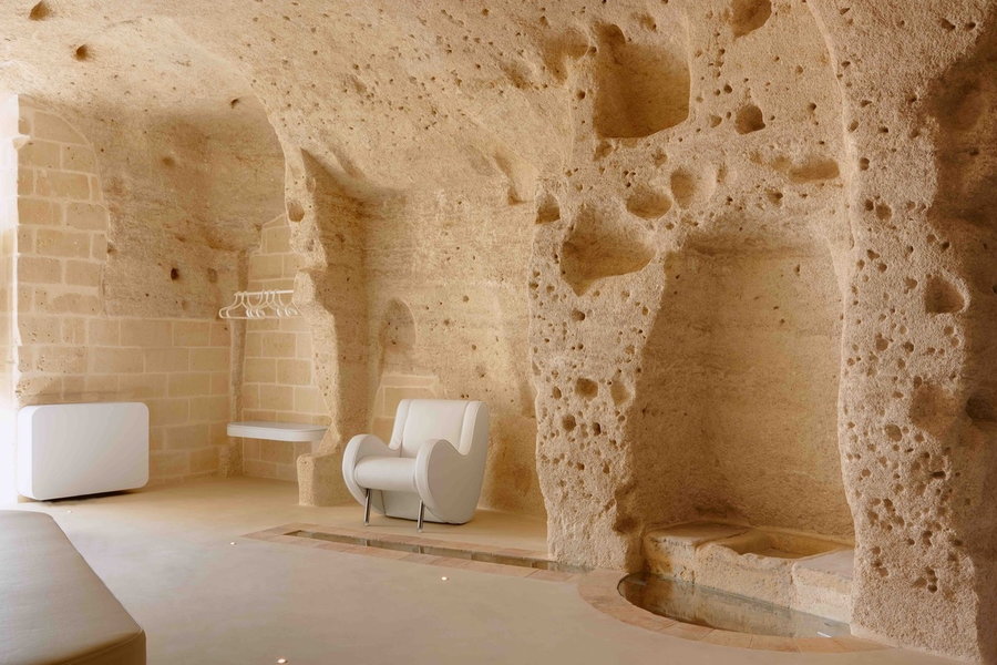 The Sassi cave system's natural limestone walls were polished and restored to their original glory during the construction of the Aquatio Hotel and Spa. 