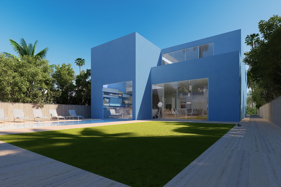 Sleek rectangular pool runs between the palm trees at the Studio Malka-designed Dunk House.  