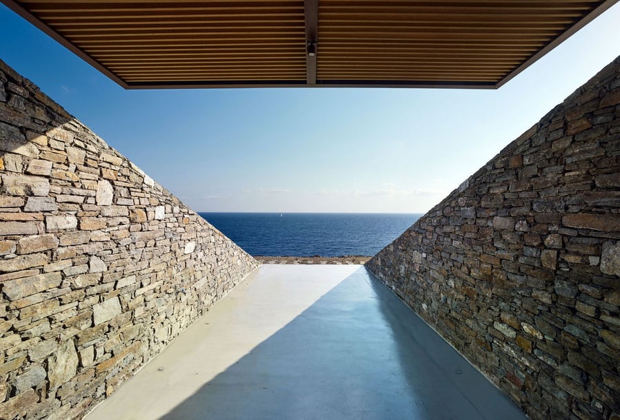 View out into the ocean from inside the modern hillside NCaved House.