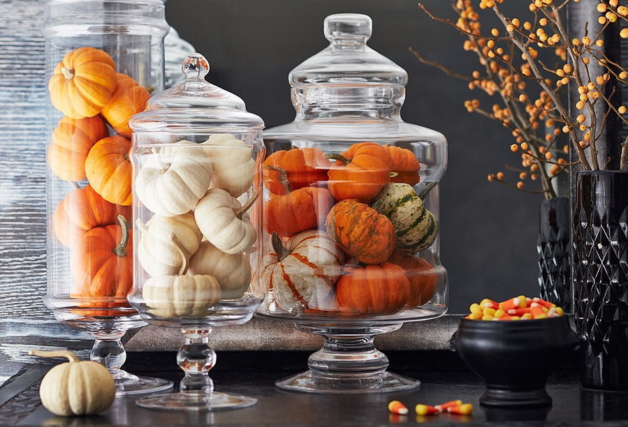Festive pumpkin and gourd-filled apothecary jars.