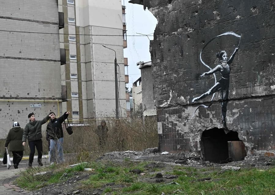 Banksy mural in Borodyanka, Ukraine depicts a young gymnast holding a streamer aloft.