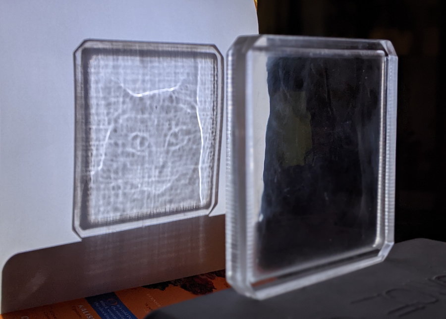 Mitski the Cat appears when light shines through Matt Ferraro's Magic Window.